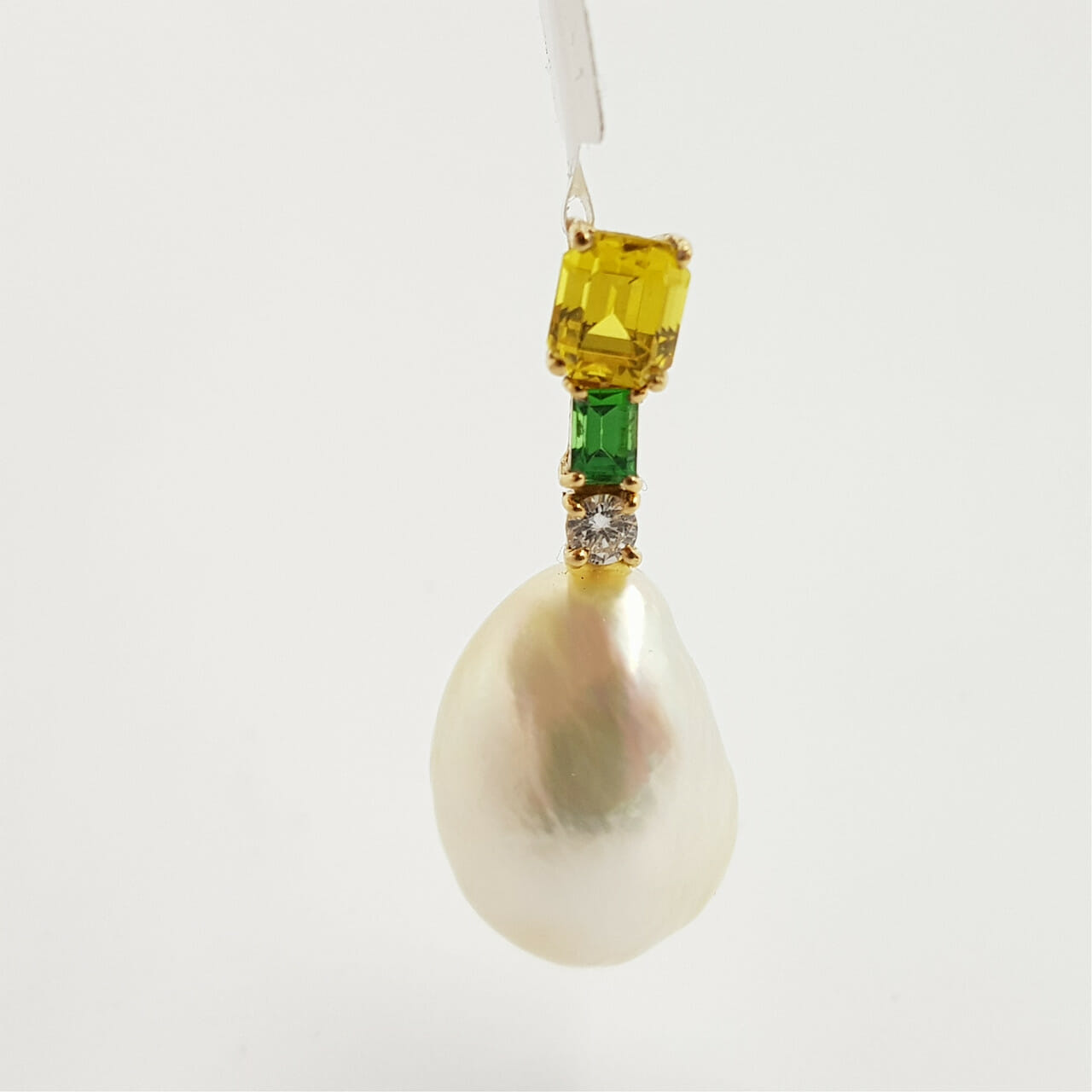 This pendant has been newly made with a trio of stones sitting above a natural pearl, set in 18ct yellow gold.