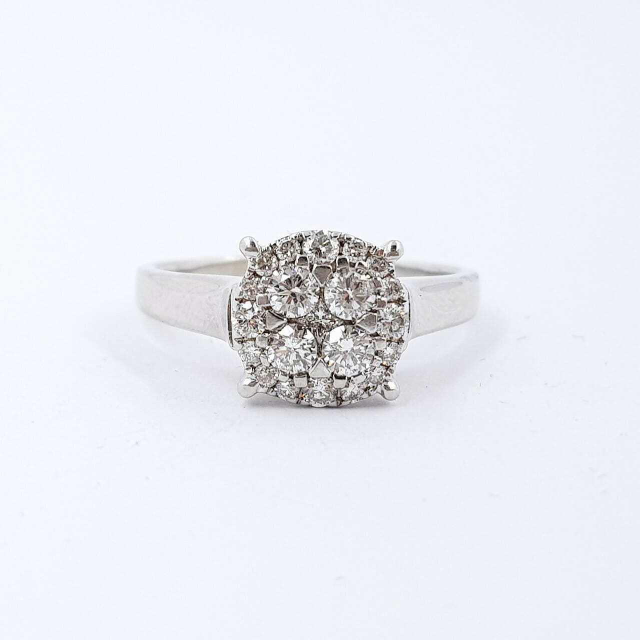 This lovely white gold ring has a flat face design set with round brilliant cut diamonds.