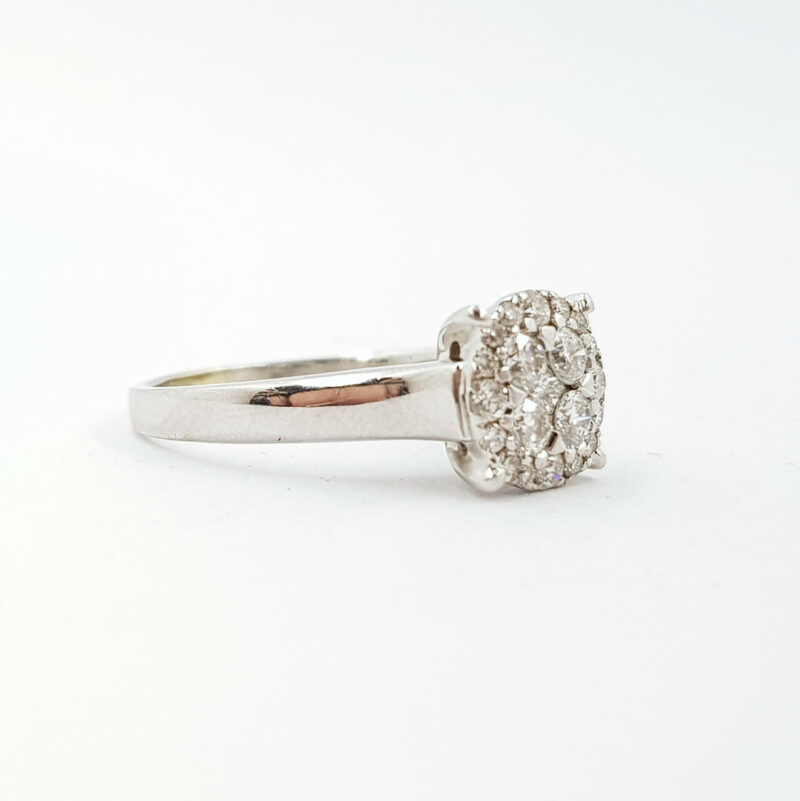 This lovely white gold ring has a flat face design set with round brilliant cut diamonds.