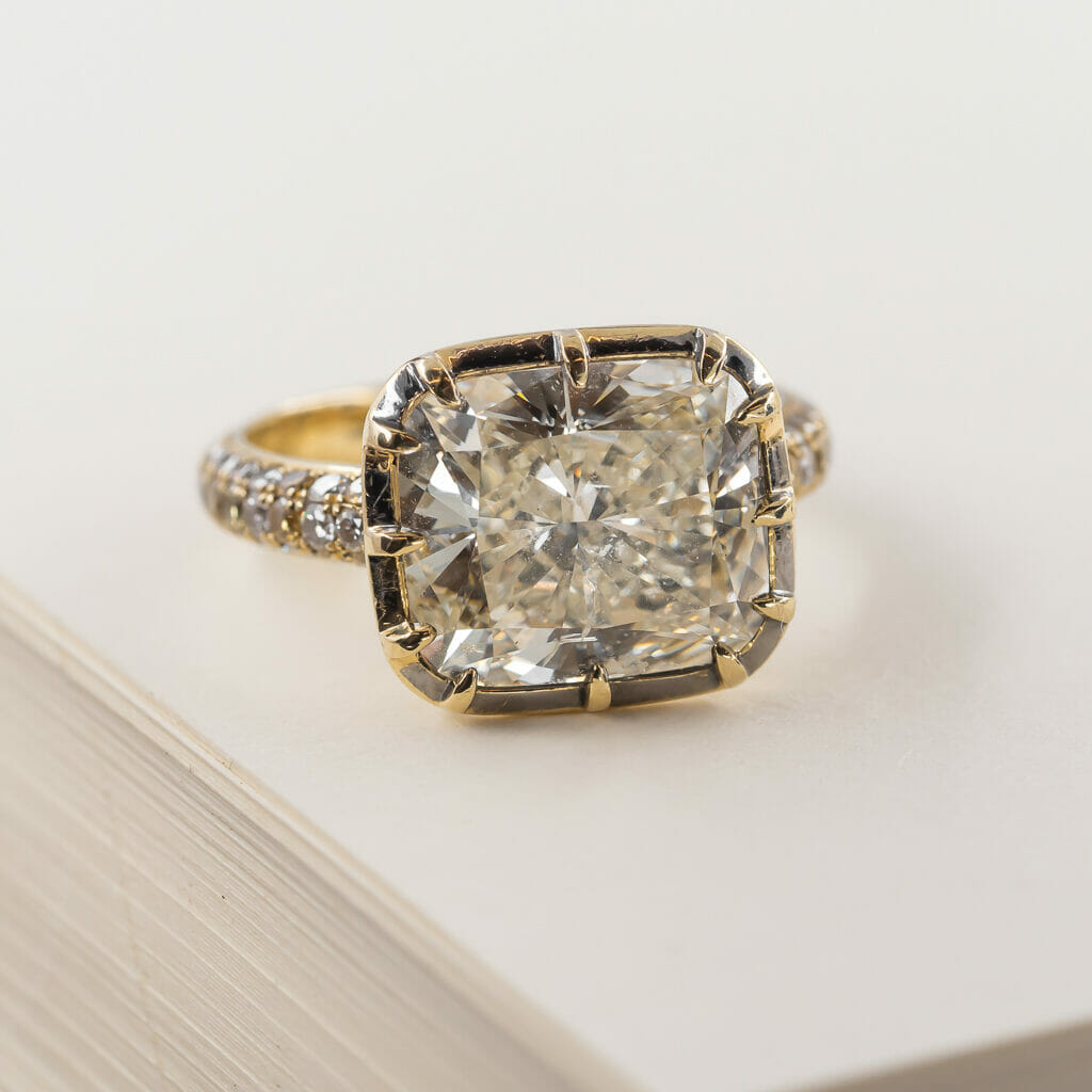 Diamond ring showing a large carat weight.