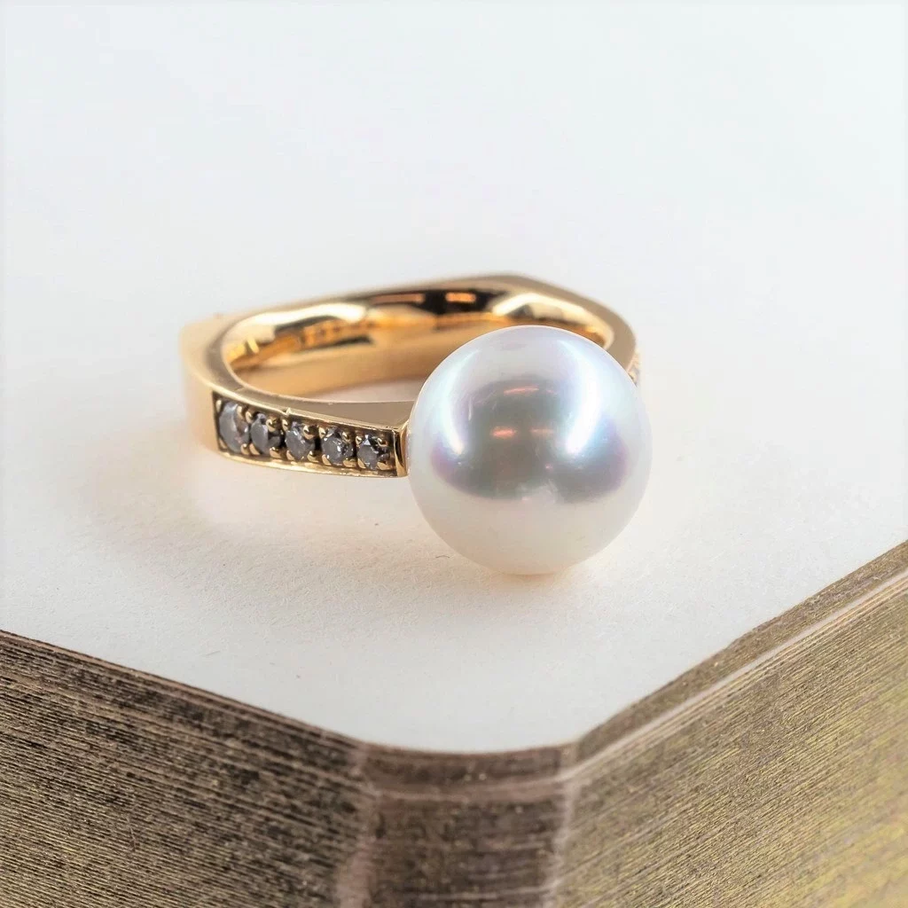 A pearl ring which is the birthstone for the month of June.