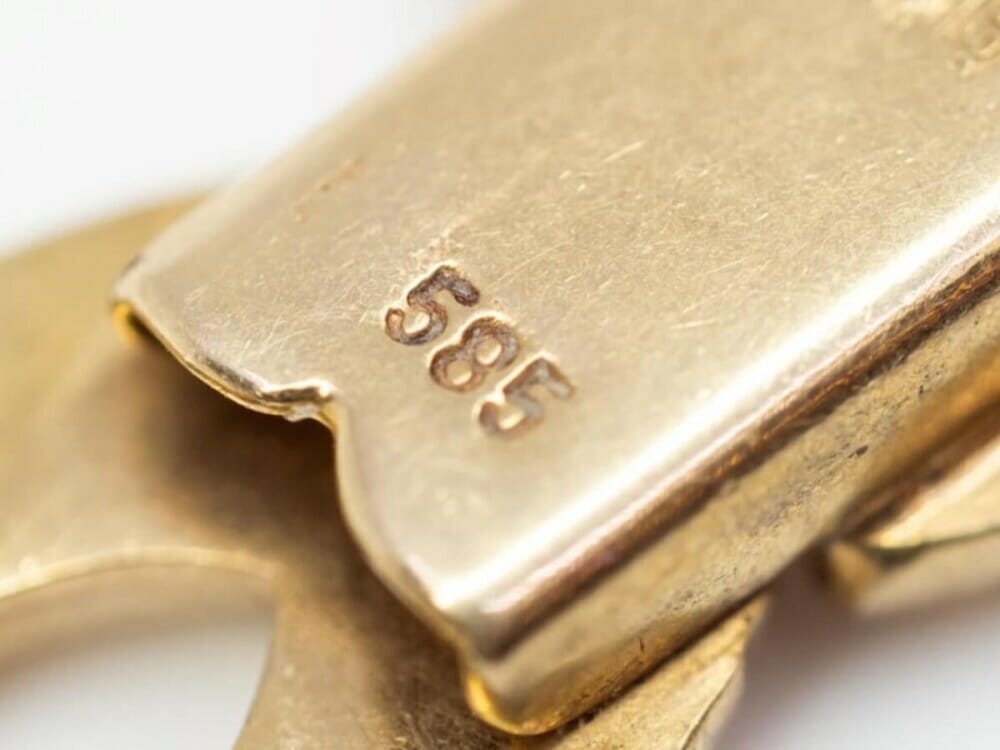 A 585 stamp on gold jewellery indicates that it is 14ct gold.
