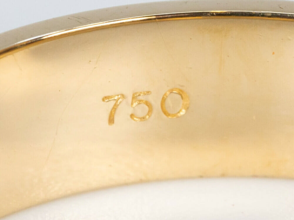 A 750 stamp on jewellery indicates that it is 18ct gold.