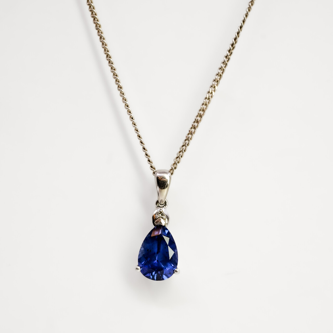 9ct White Gold Sapphire & Diamond Pendant on Sterling Silver Chain #66792 9ct White Gold Synthetic Sapphire & Diamond Pendant on Sterling Silver Chain